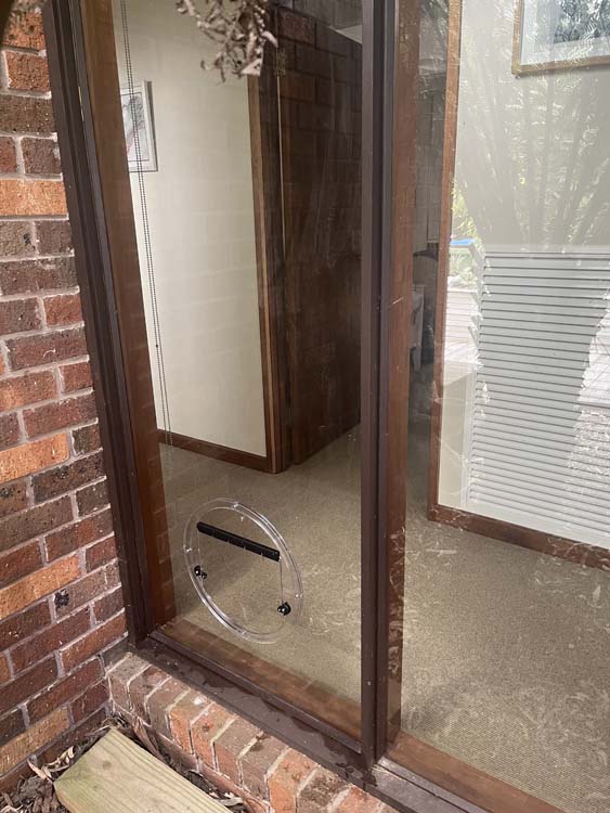 Dog Door installed in a window in Boneo